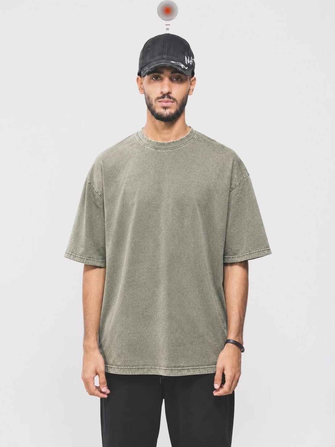 Olive Acid Washed Oversized T-Shirt — model wearing tee, front view